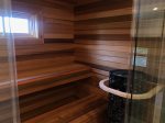 Full Bathroom with Soaking Tub and Sauna